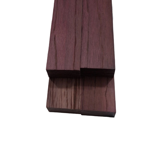 Wooden block with a purple-brown finish on a white background